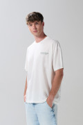 Camiseta oversize crema manga corta con diseños de playa