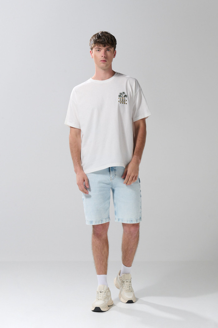 Camiseta manga corta oversize crema con diseños de playa