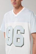 Camiseta cuello V oversize crema clara con arte college
