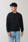 Buzo unicolor cuello redondo oversize con bolsillo
