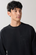 Buzo unicolor cuello redondo oversize con bolsillo
