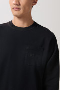 Buzo unicolor cuello redondo oversize con bolsillo