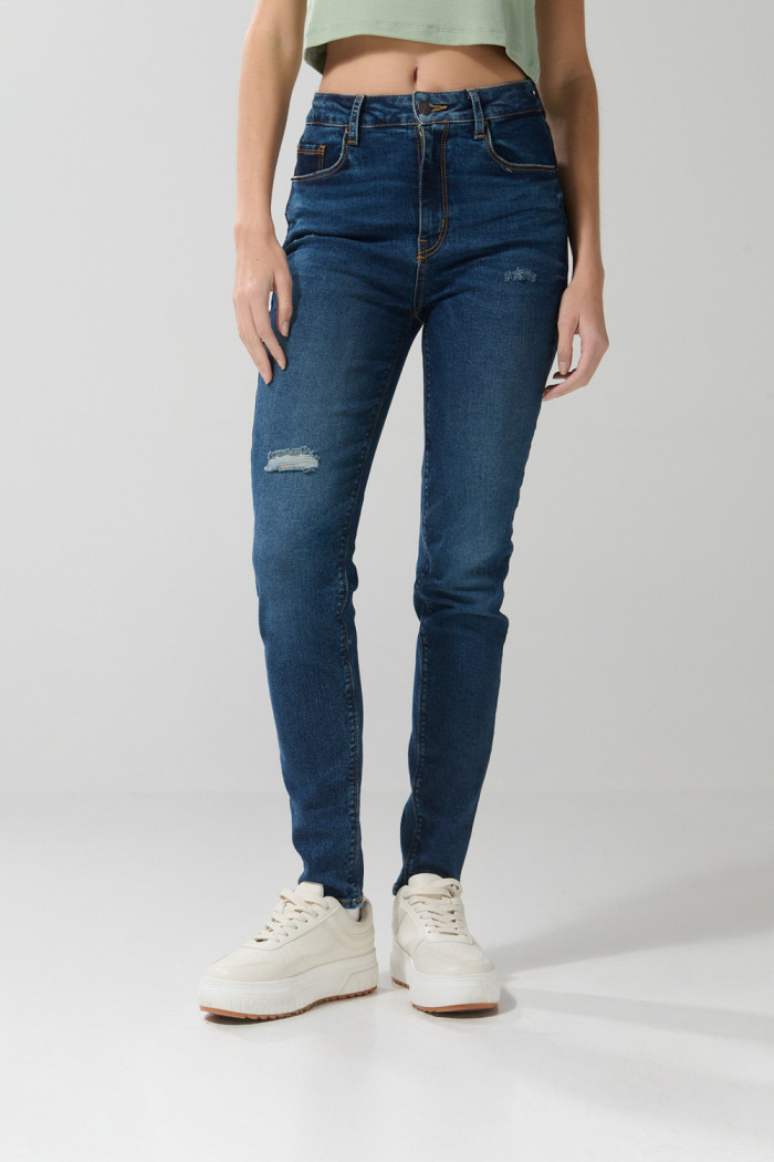 Jean azul oscuro jegging con rotos y tiro súper alto