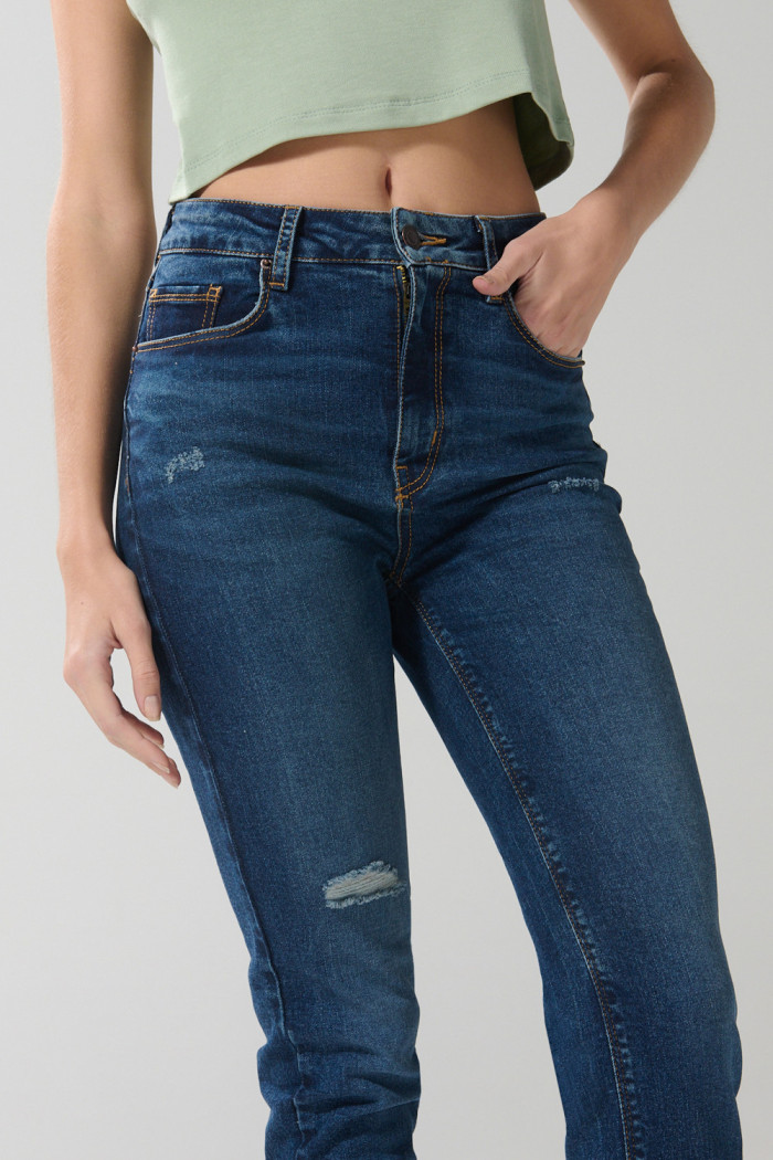 Jean azul oscuro jegging con rotos y tiro súper alto