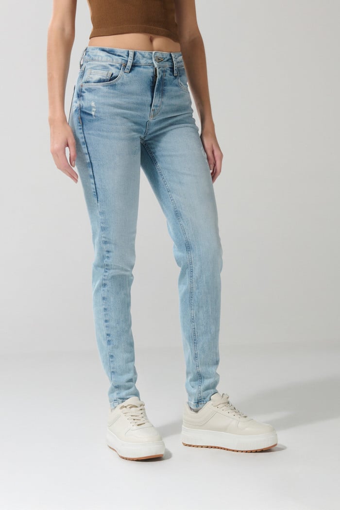 Jean tiro alto jegging ceñido azul claro con bolsillos