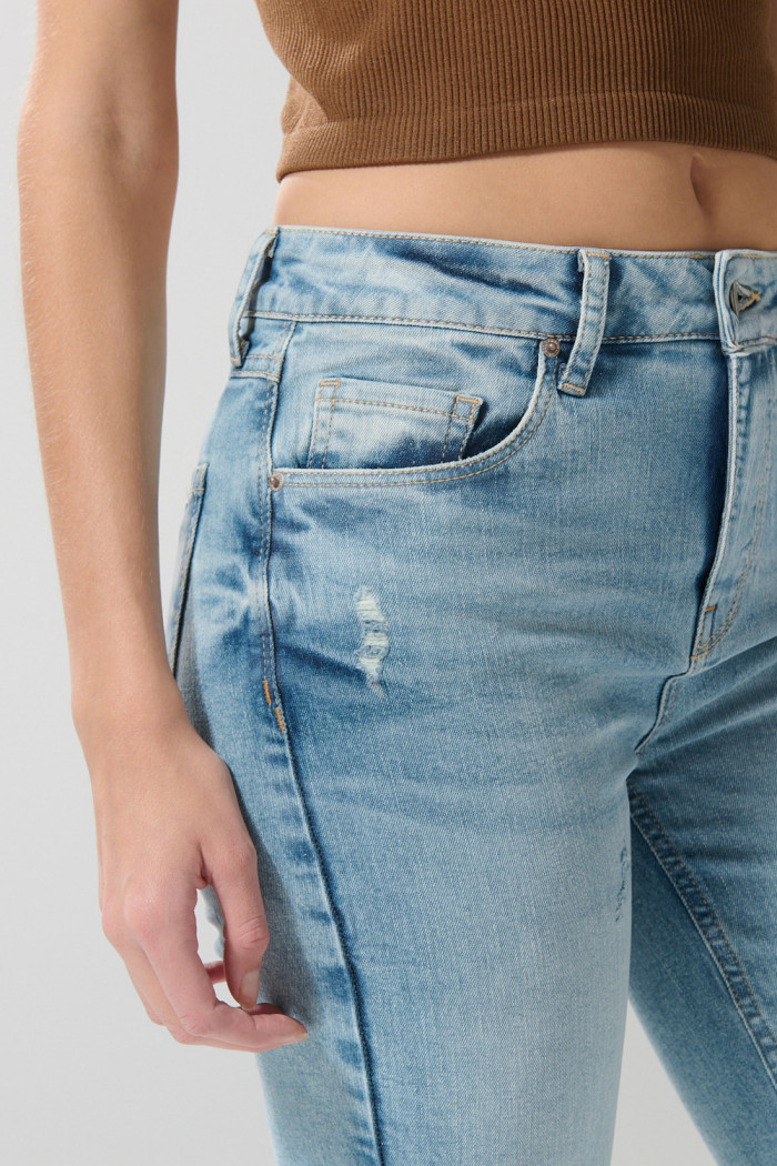 Jean tiro alto jegging ceñido azul claro con bolsillos