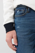 Jean azul oscuro slim tiro bajo con rotos en frente