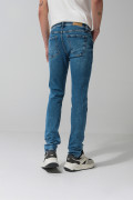 Jean skinny azul claro ajustado con rotos y tiro bajo