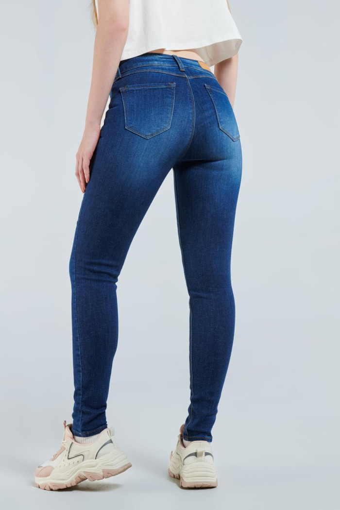 Jean Jegging azul oscuro con tiro alto, bolsillos y ajuste ceñido