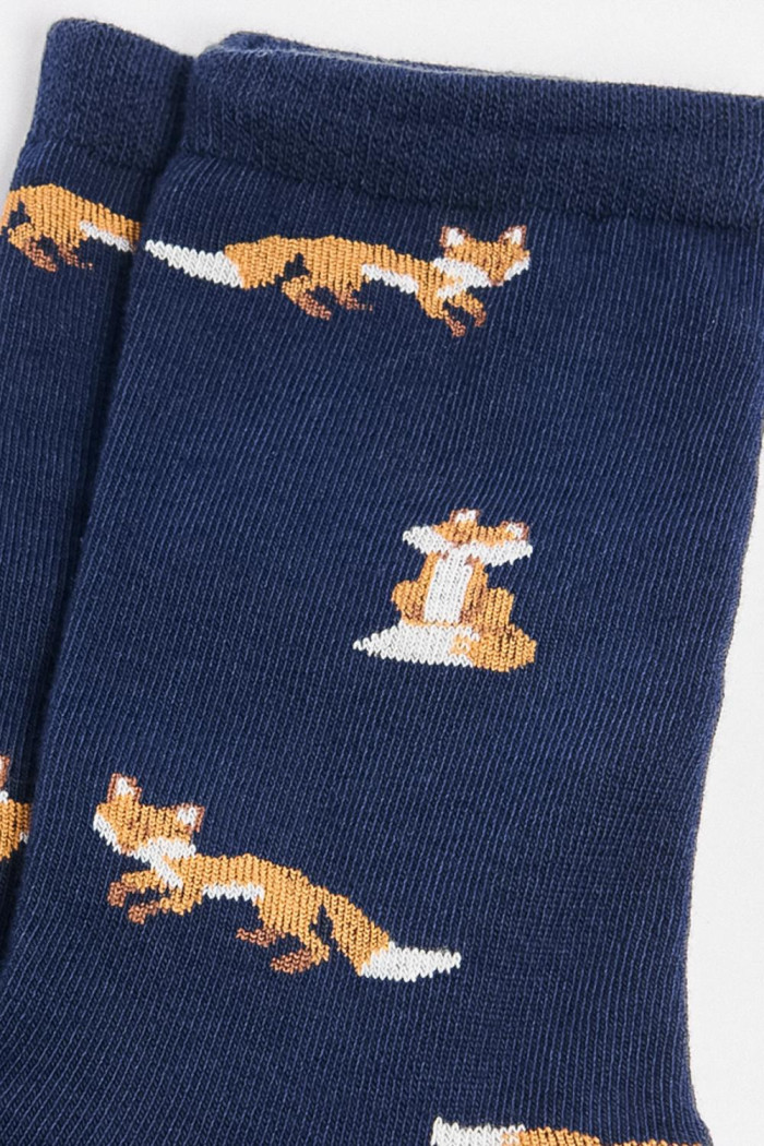 Medias largas azules oscuras con diseños de animales