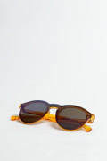 Gafas amarillas de sol con marco redondo y lentes azules