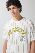 Camiseta a rayas crema oversize manga corta de Snoopy