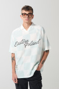 Camiseta crema a cuadros college oversize con cuello polo