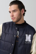 Chaqueta azul bomber college con mangas en contraste