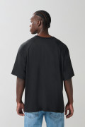 Camiseta manga ranglan unicolor oversize con arte college