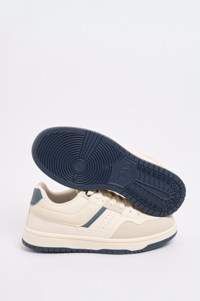 Tenis casuales unicolores con perforaciones y contrastes