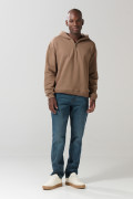 Buzo oversize unicolor con capota y cremallera