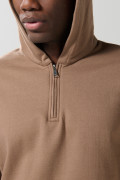Buzo oversize unicolor con capota y cremallera