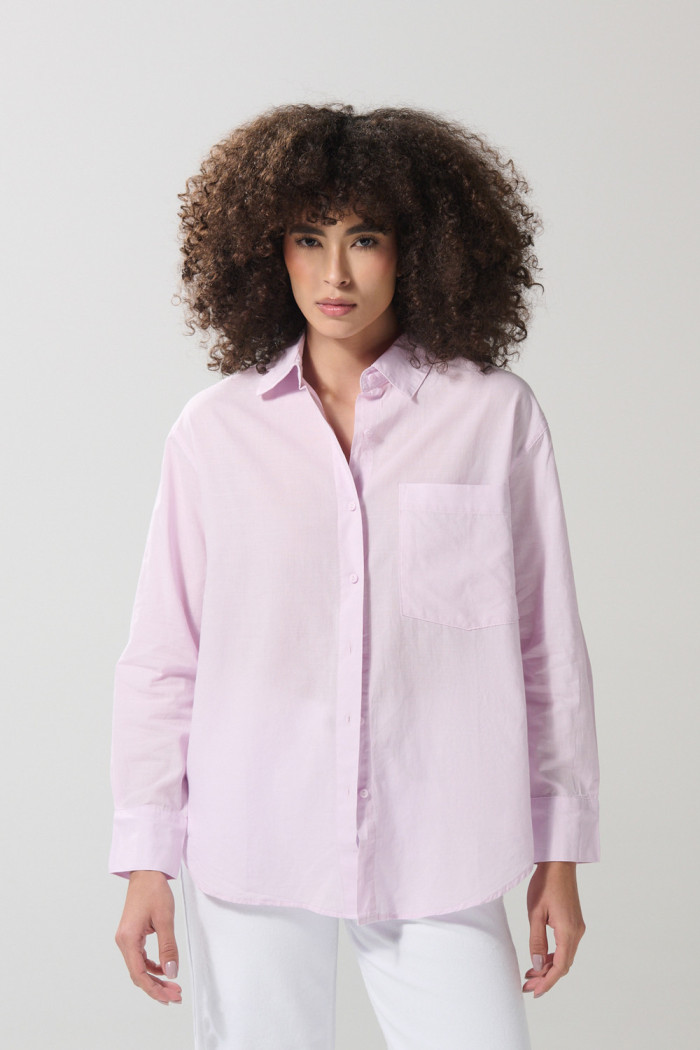 Blusa unicolor manga larga en algodón con bolsillo
