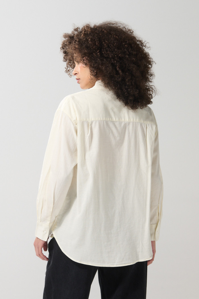 Blusa unicolor manga larga en algodón con bolsillo