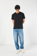 Jean baggy tiro medio azul claro con bota ancha y desgastes