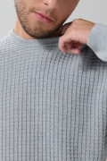Suéter cuello redondo unicolor con texturas de cuadros