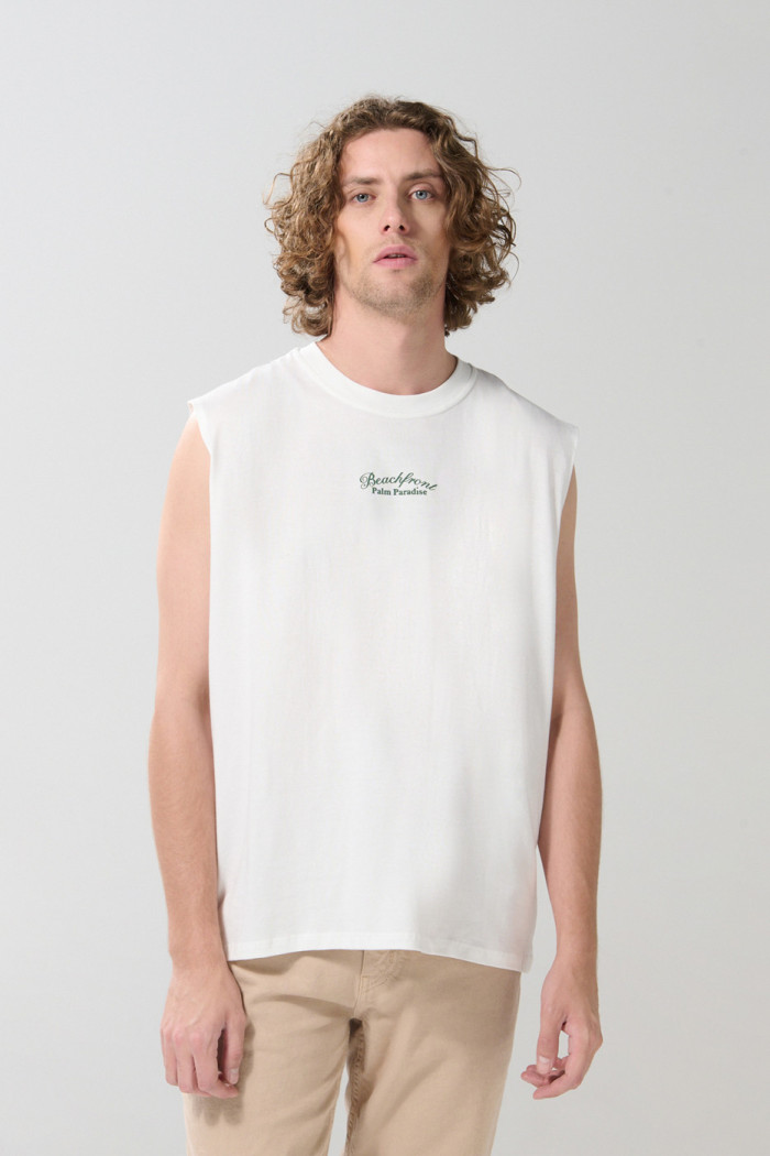 Camiseta manga sisa unicolor oversize con arte de playa