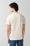 Camiseta unicolor cuello redondo con arte college de playa
