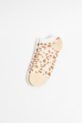 Medias tobilleras cremas con arte animal print y contrastes