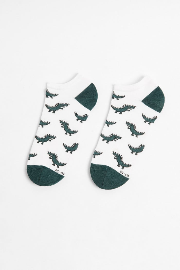 Medias tobilleras cremas con diseños de dinosaurios