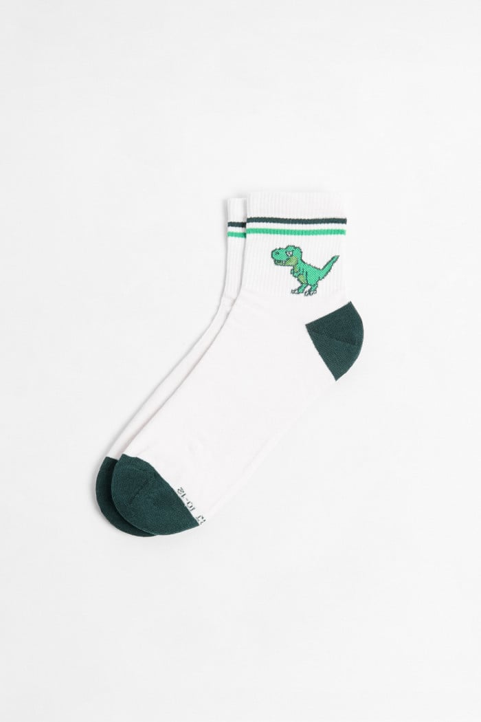 Medias cortas cremas claras con diseño de dinosaurio