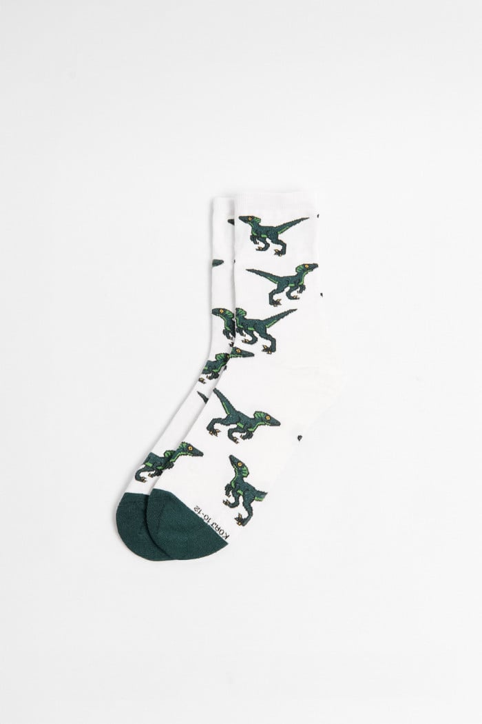 Medias cremas largas con diseños de dinosaurios