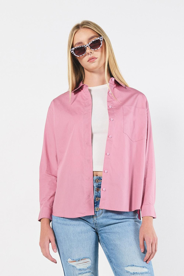 Blusa oversize unicolor con manga larga y bolsillo