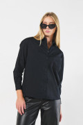 Blusa oversize unicolor con manga larga y bolsillo
