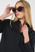 Blusa oversize unicolor con manga larga y bolsillo