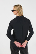 Blusa oversize unicolor con manga larga y bolsillo