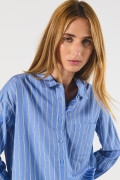 Blusa unicolor a rayas oversize con manga larga