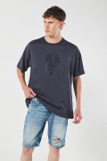 Bermuda tiro bajo azul slim en jean con rotos en frente