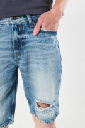 Bermuda tiro bajo azul slim en jean con rotos en frente