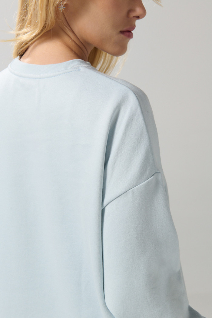 Buzo unicolor oversize con cuello redondo