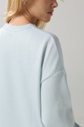 Buzo unicolor oversize con cuello redondo