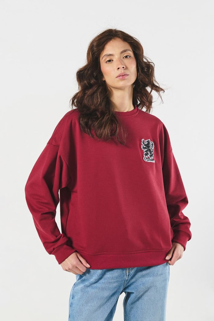 Buzo rojo oversize cuello redondo con arte de Harry Potter