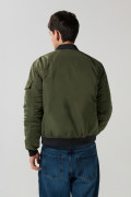 Chaqueta unicolor bomber con bolsillos y acabados en rib