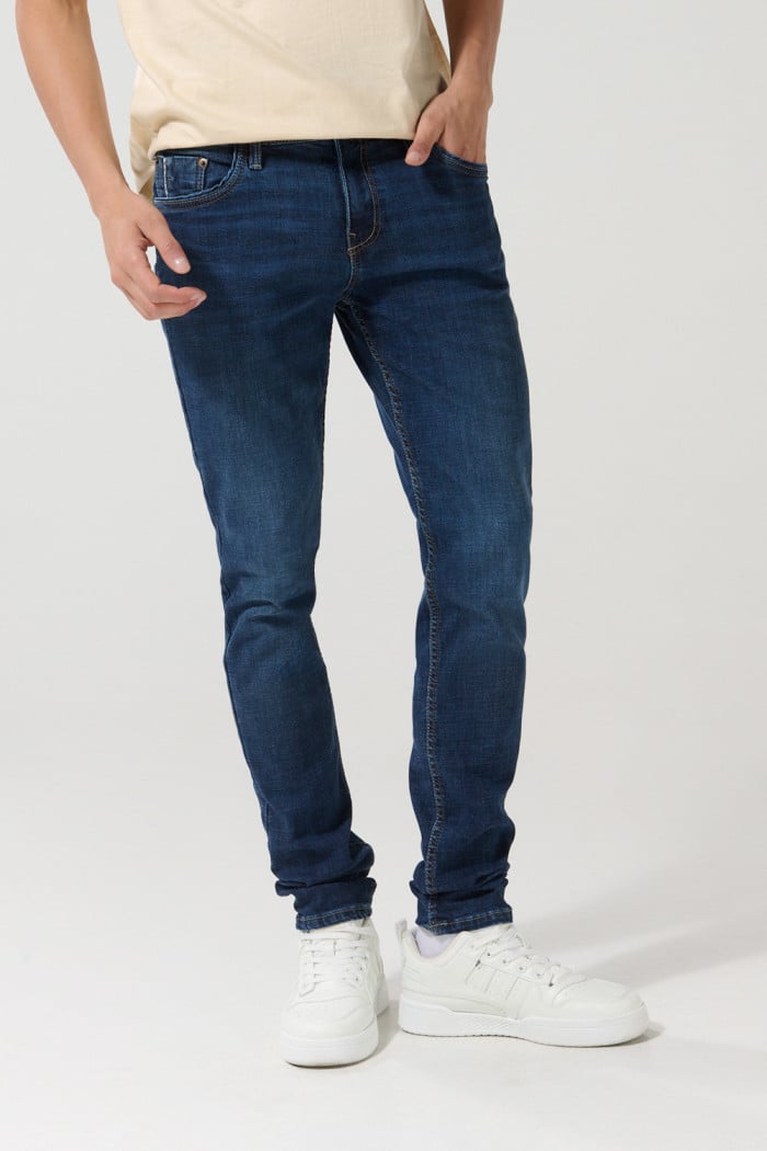 Jean skinny ajustado azul oscuro con cremallera y tiro bajo