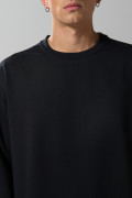 Buzo hombro rodado unicolor con cuello redondo