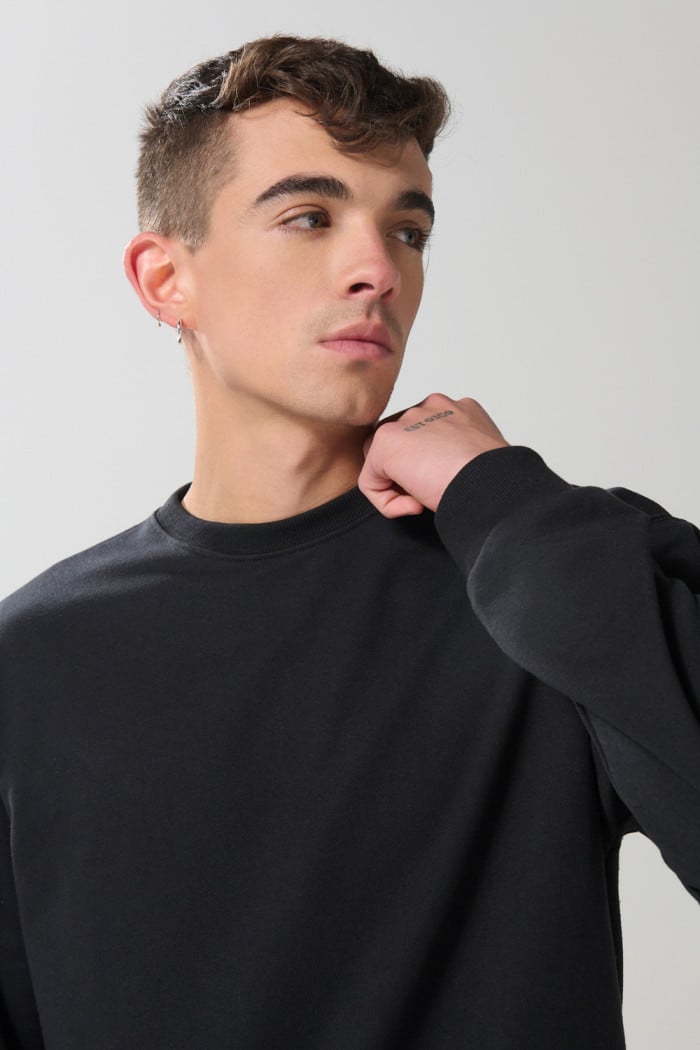 Buzo manga larga unicolor con cuello redondo