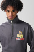 Buzo de Tom y Jerry oversize gris con cuello alto