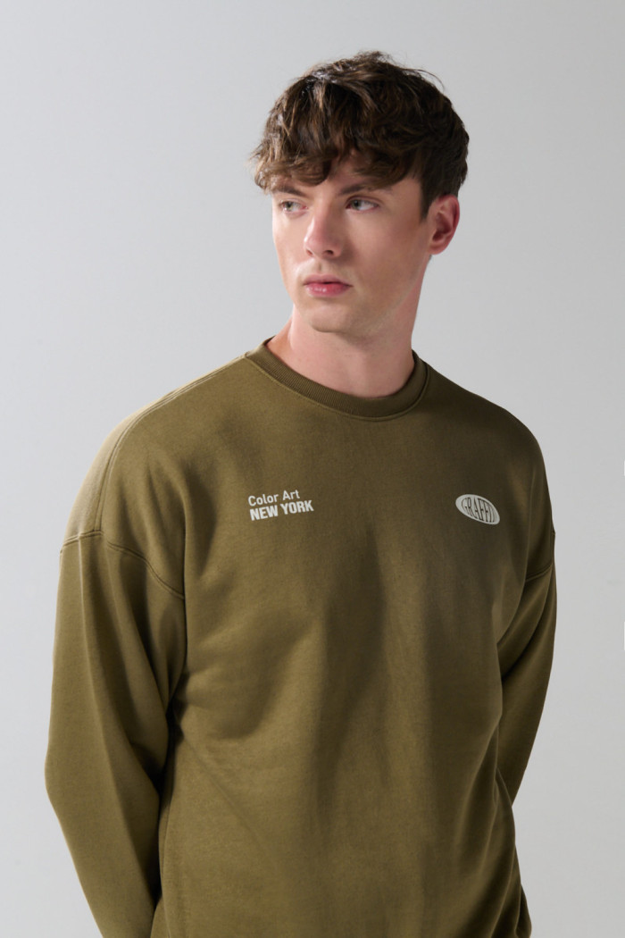 Buzo artístico urbano unicolor oversize cuello redondo