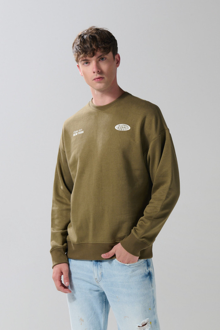 Buzo artístico urbano unicolor oversize cuello redondo
