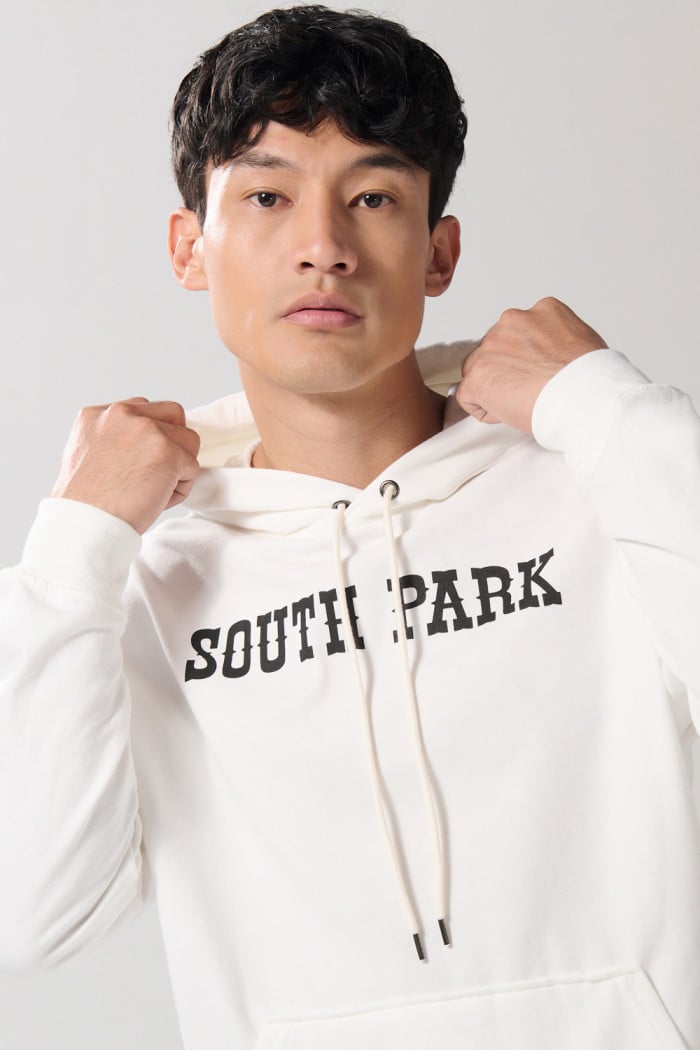 Buzo oversize crema de South Park con capota y bolsillo